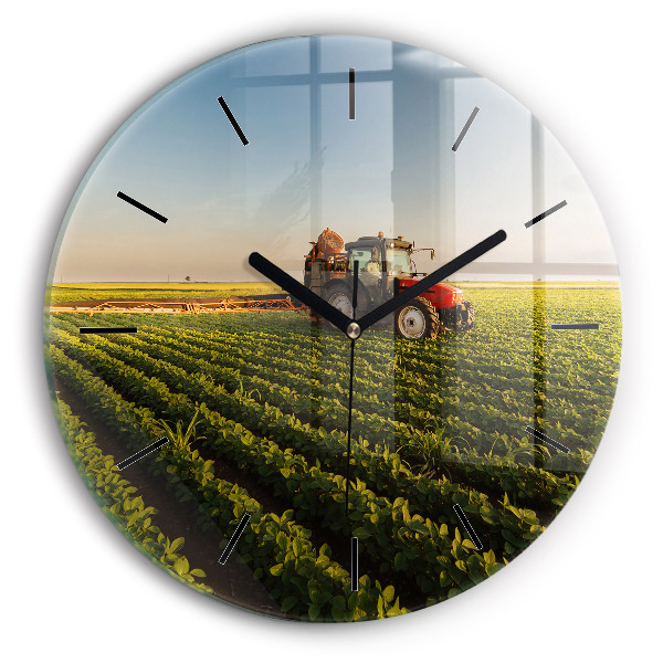 Round glass clock Tractor in a farm field