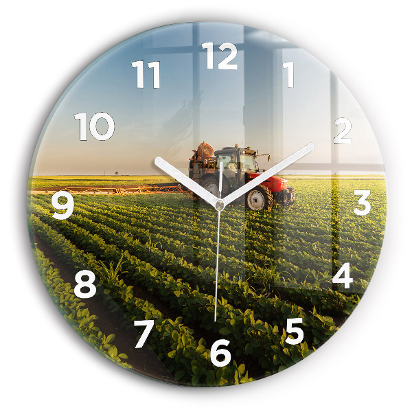 Round glass clock Tractor in a farm field