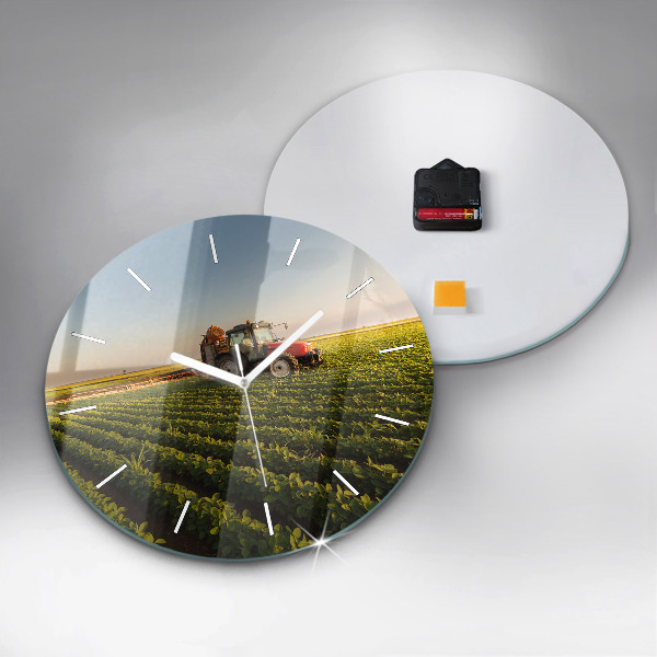 Round glass clock Tractor in a farm field