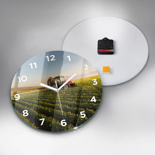 Round glass clock Tractor in a farm field