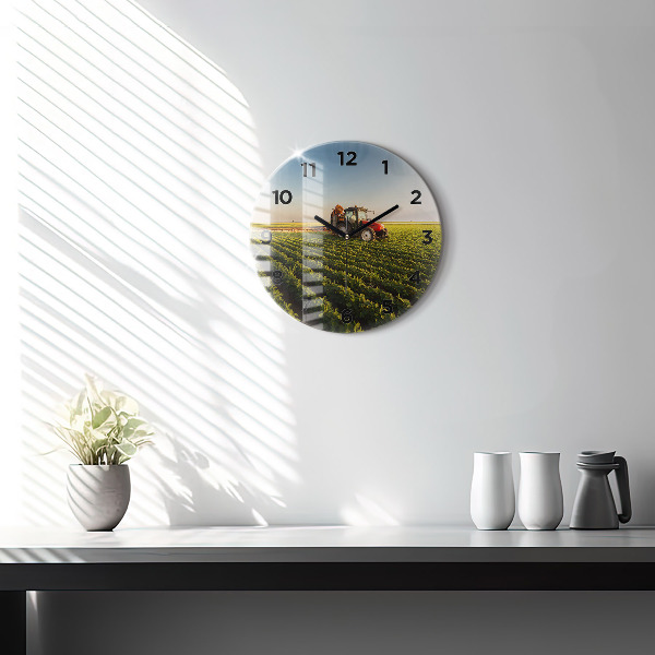 Round glass clock Tractor in a farm field