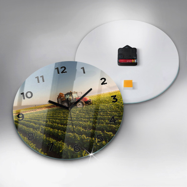 Round glass clock Tractor in a farm field