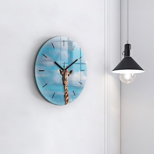 Round glass clock Giraffe head against the sky