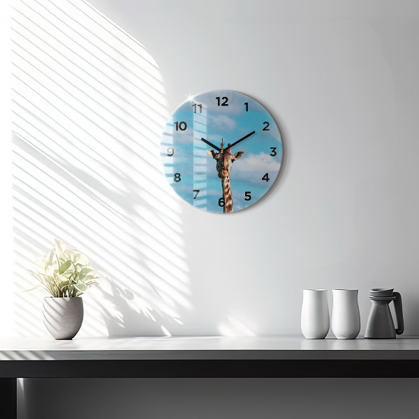 Round glass clock Giraffe head against the sky
