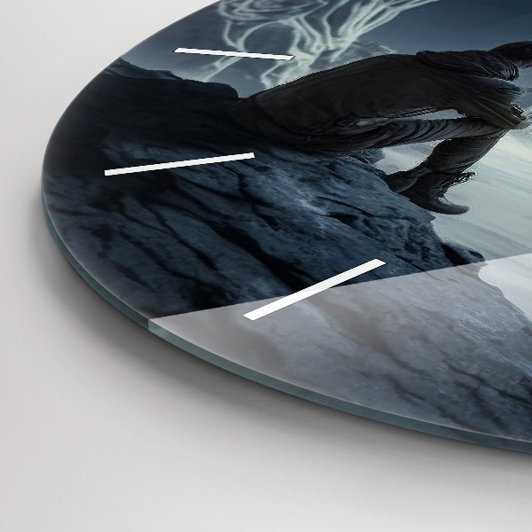 Round glass clock Man in front of the moon