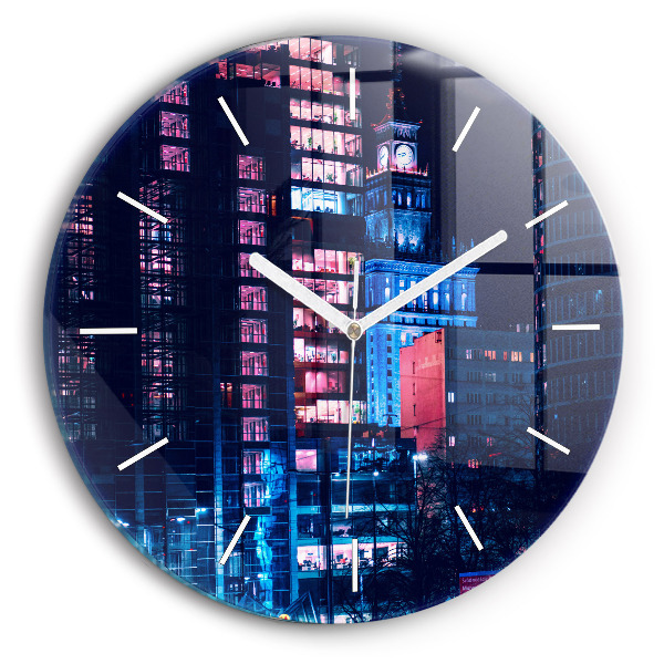 Round glass clock Warsaw at night