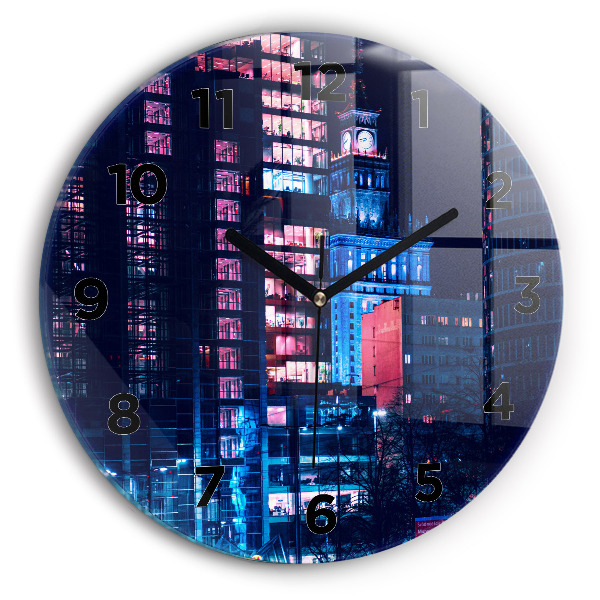 Round glass clock Warsaw at night