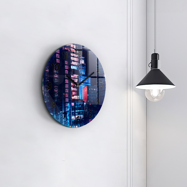 Round glass clock Warsaw at night