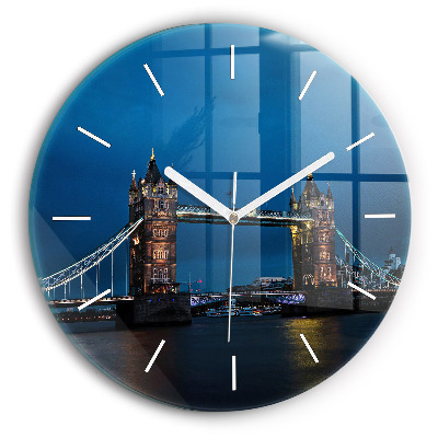 Round glass clock Tower Bridge London at night