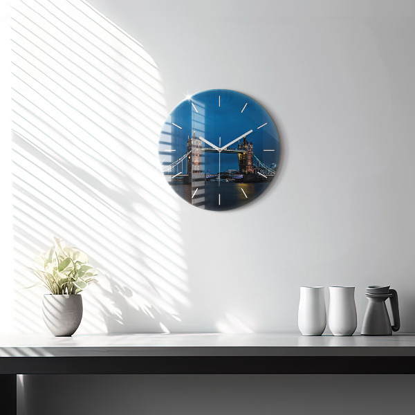 Round glass clock Tower Bridge London at night