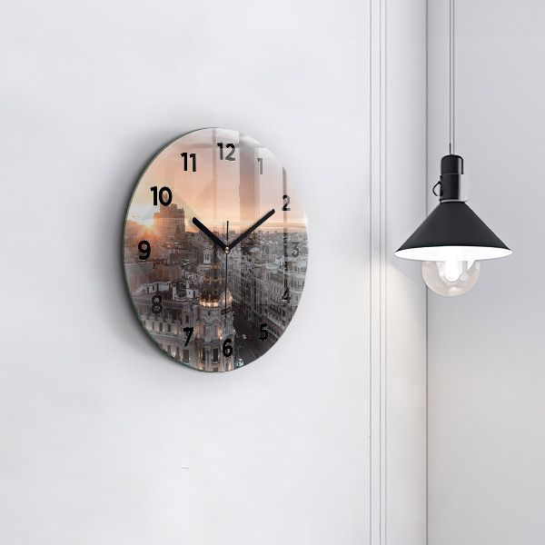 Round glass clock Cities at sunset