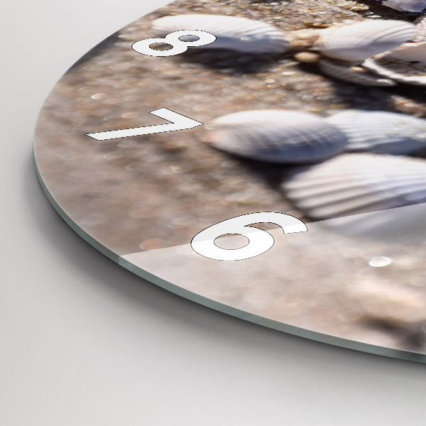 Round glass clock Seashells on the beach