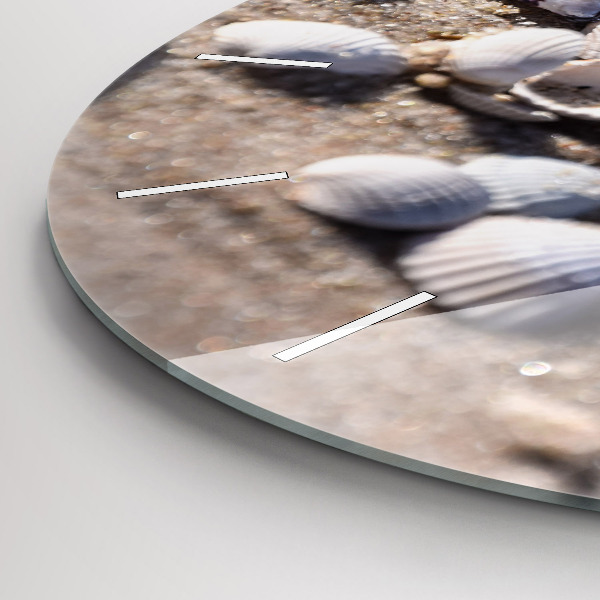Round glass clock Seashells on the beach
