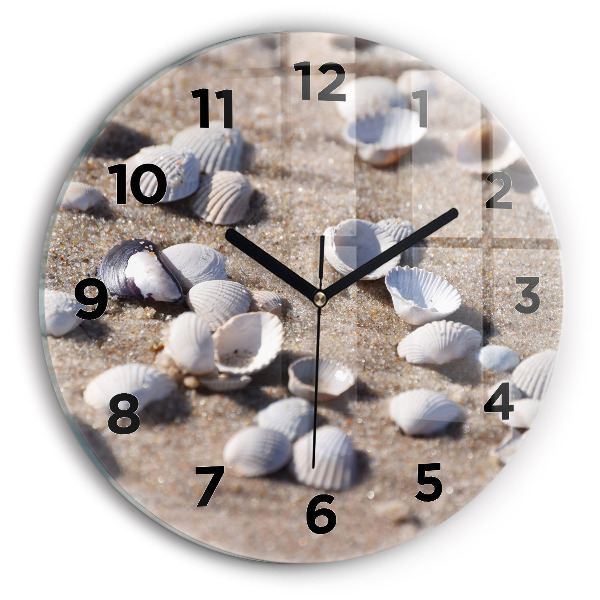 Round glass clock Seashells on the beach