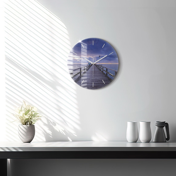Round glass clock Pier on the Baltic Sea