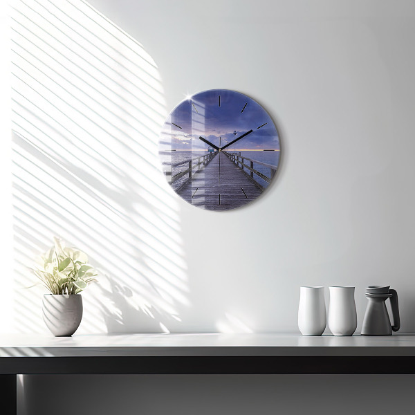 Round glass clock Pier on the Baltic Sea