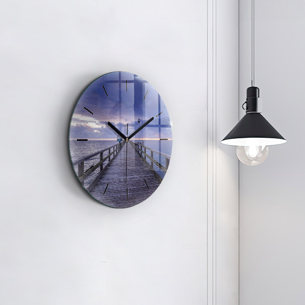 Round glass clock Pier on the Baltic Sea
