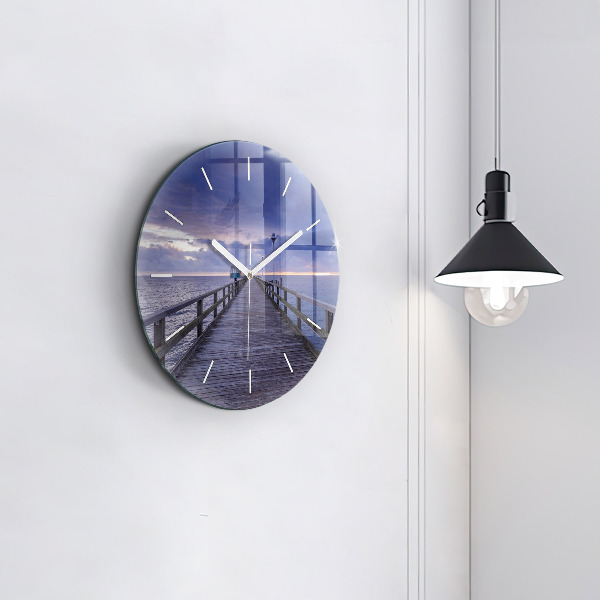 Round glass clock Pier on the Baltic Sea
