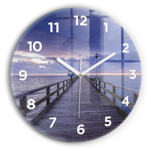 Round glass clock Pier on the Baltic Sea