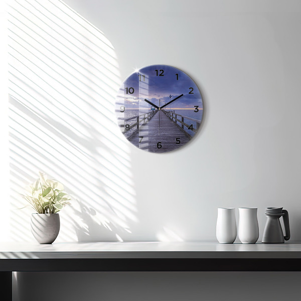 Round glass clock Pier on the Baltic Sea
