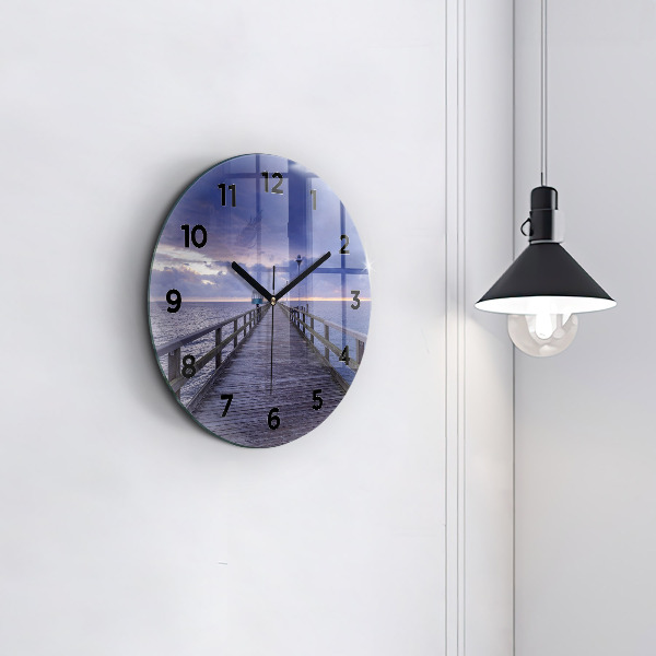 Round glass clock Pier on the Baltic Sea