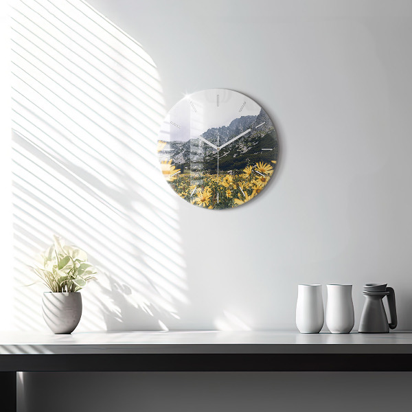 Round glass clock Meadow flowers in the mountains