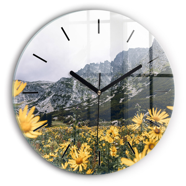 Round glass clock Meadow flowers in the mountains