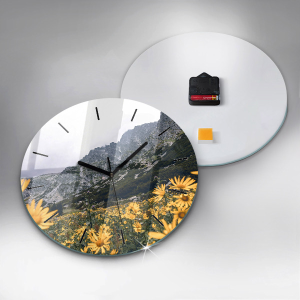 Round glass clock Meadow flowers in the mountains