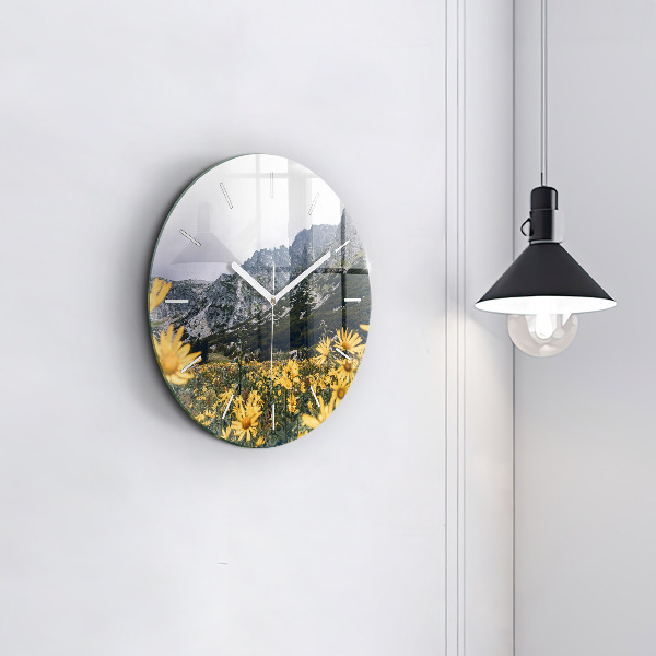 Round glass clock Meadow flowers in the mountains