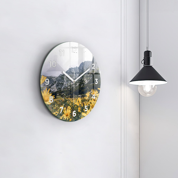 Round glass clock Meadow flowers in the mountains