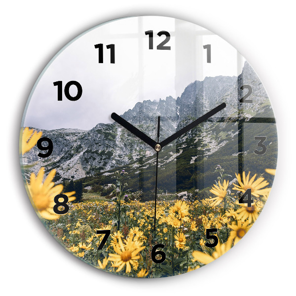 Round glass clock Meadow flowers in the mountains