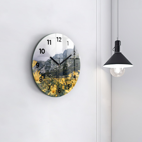 Round glass clock Meadow flowers in the mountains