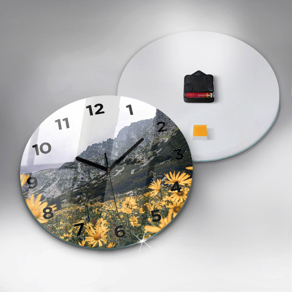 Round glass clock Meadow flowers in the mountains