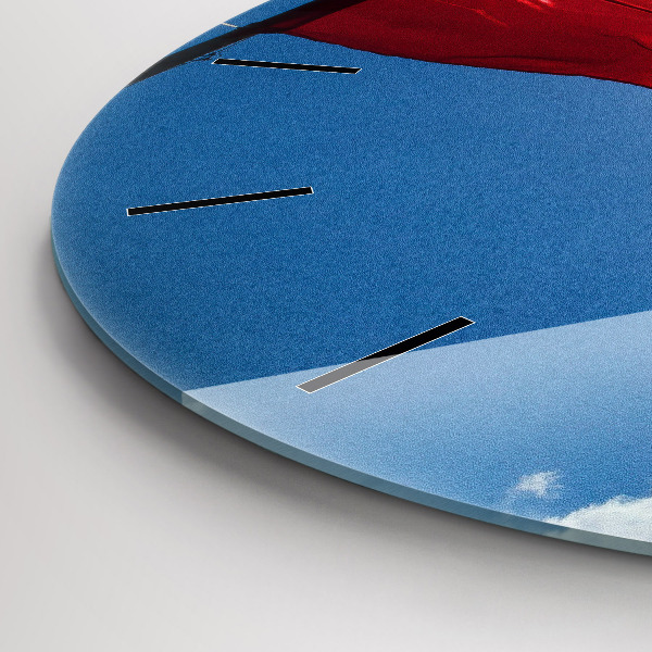 Round glass clock The Polish flag against the sky