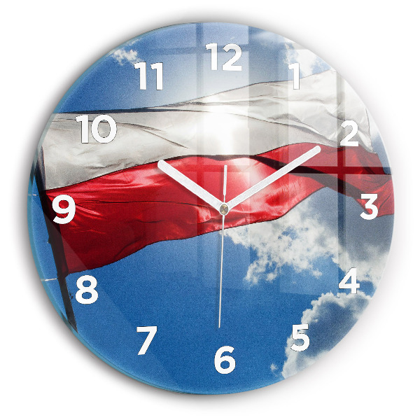 Round glass clock The Polish flag against the sky
