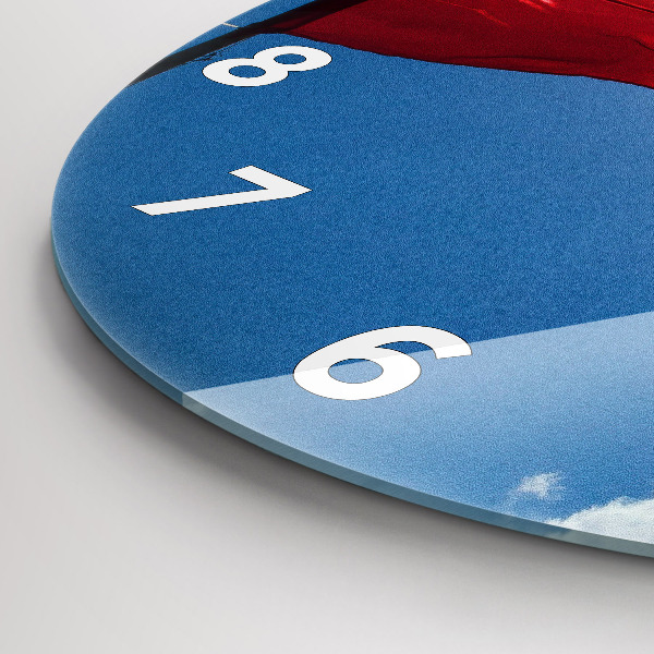 Round glass clock The Polish flag against the sky