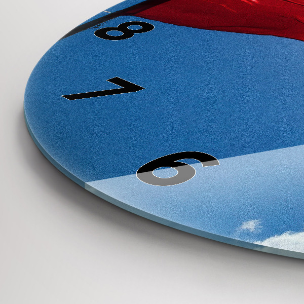 Round glass clock The Polish flag against the sky