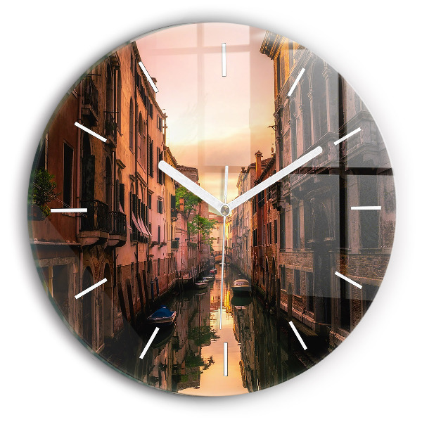 Round glass clock View of the canal in the city