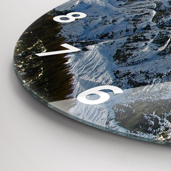 Round glass clock Mountains under blue sky