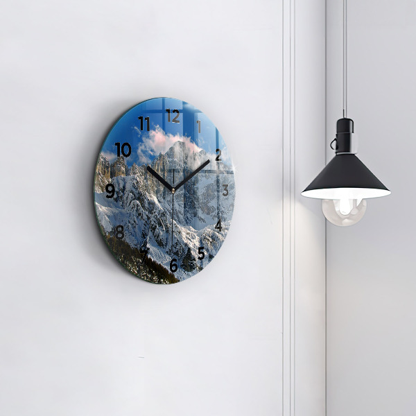 Round glass clock Mountains under blue sky