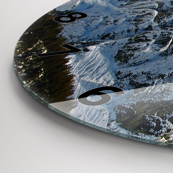 Round glass clock Mountains under blue sky