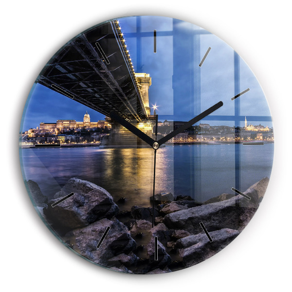 Round glass clock Rocky shore under the bridge