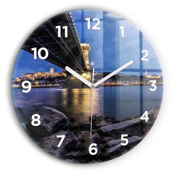 Round glass clock Rocky shore under the bridge