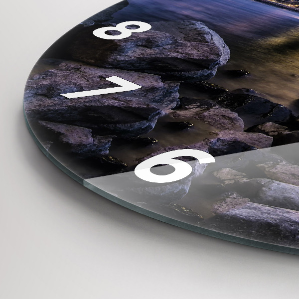 Round glass clock Rocky shore under the bridge