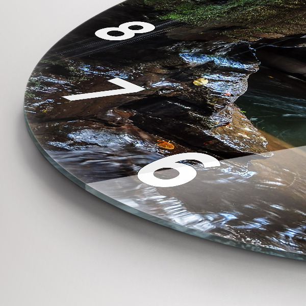 Round glass clock Waterfall and rocks of Iceland