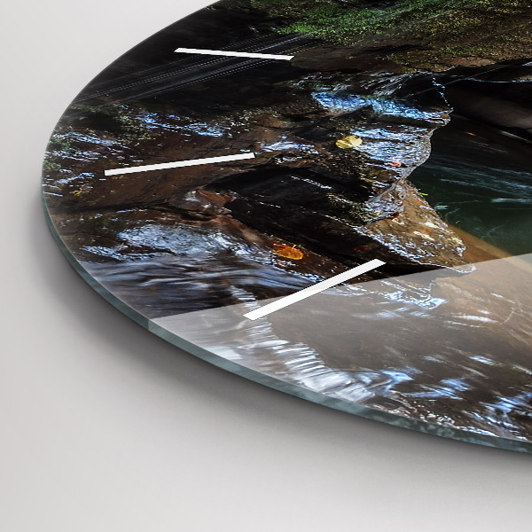 Round glass clock Waterfall and rocks of Iceland