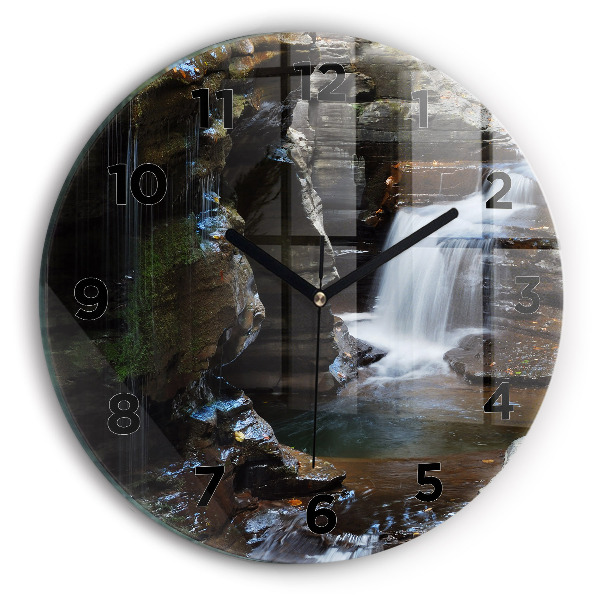 Round glass clock Waterfall and rocks of Iceland