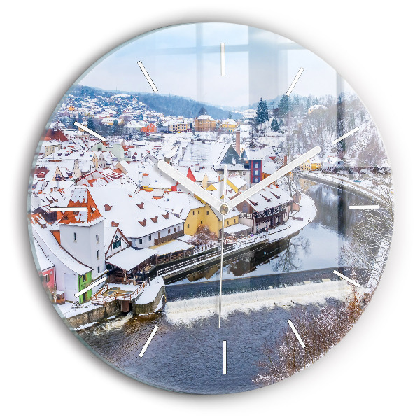 Round glass clock Panorama of the city in winter