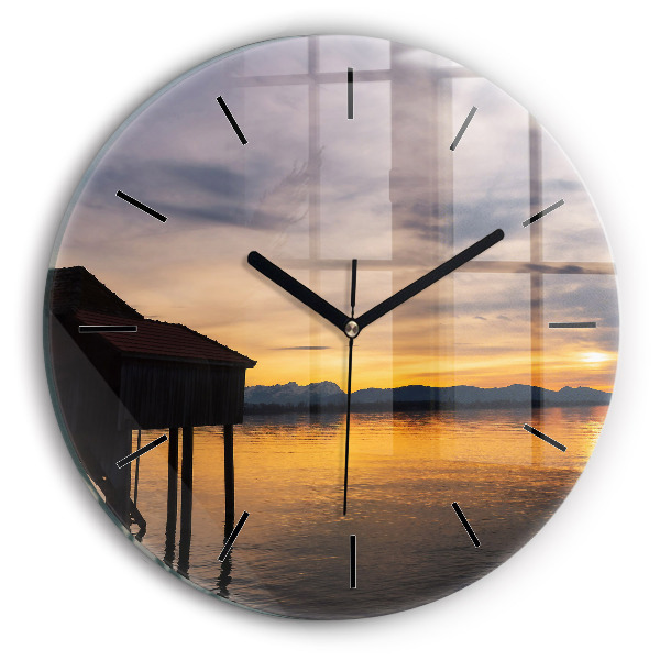 Round glass clock Sunset over the lake