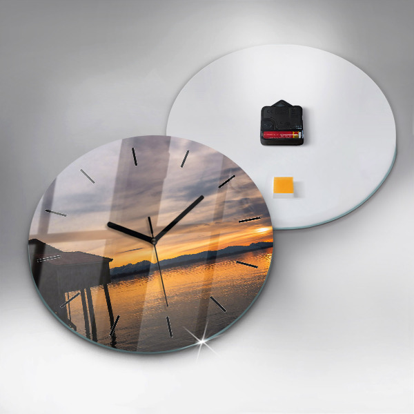Round glass clock Sunset over the lake